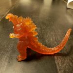 Little orange Godzilla